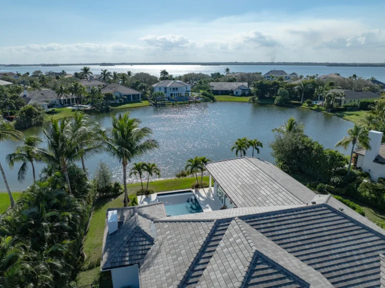 house aerial shot with view of inlet
