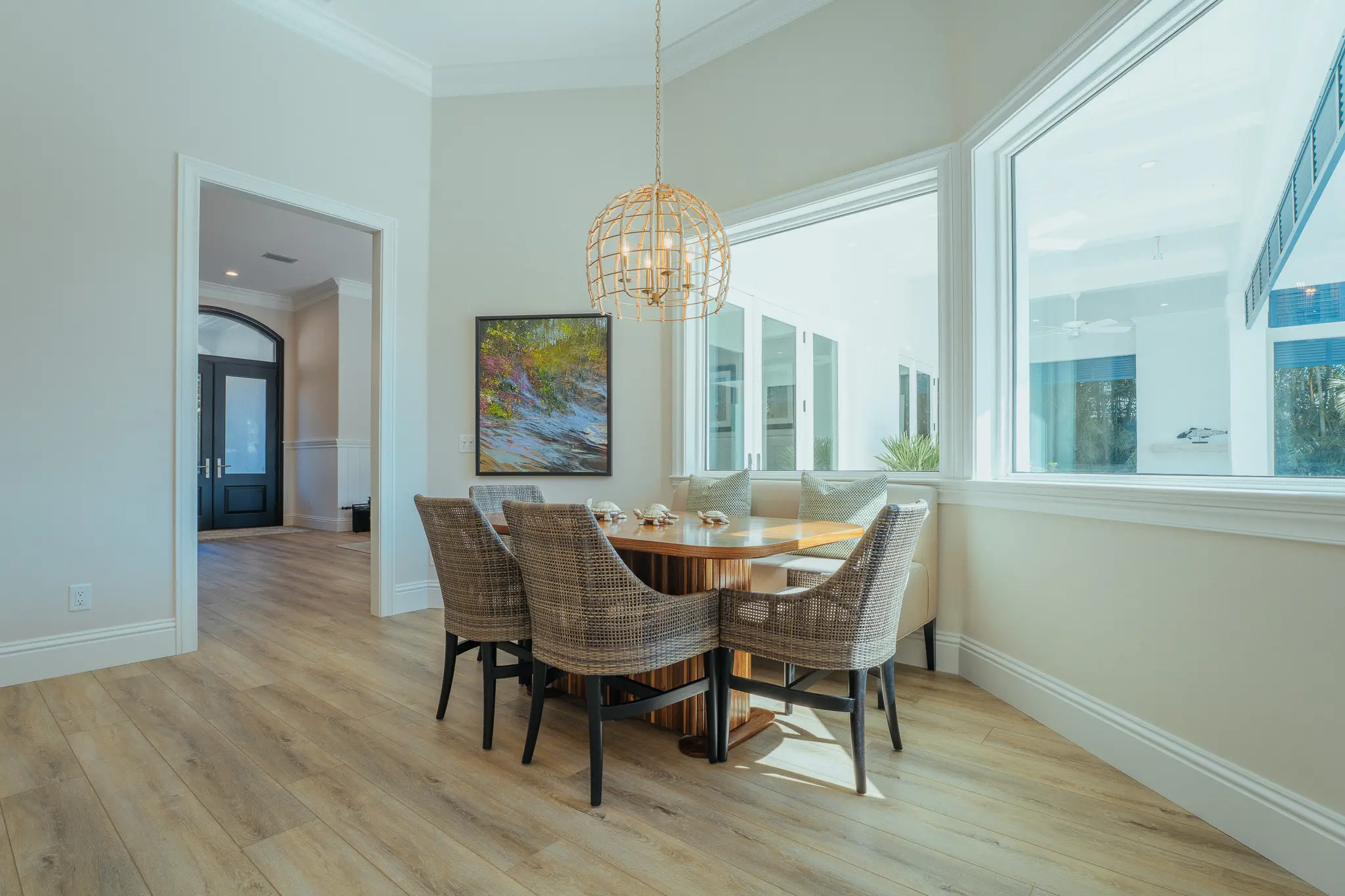 dinner table area with windows looking out at patio