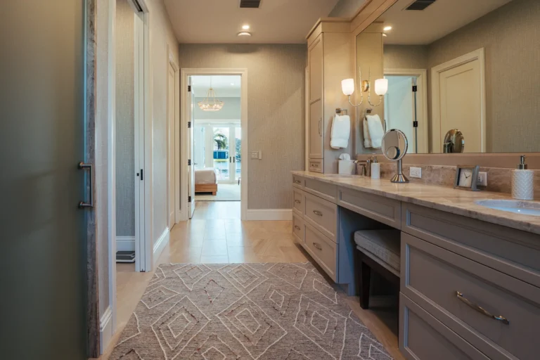 remodeled bathroom leading to bedroom with view of inlet
