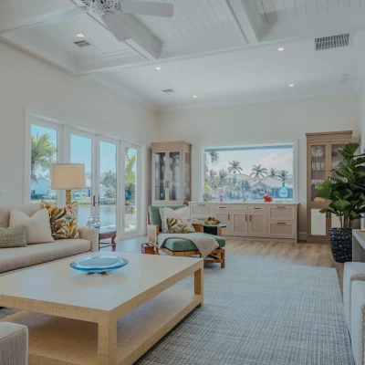living room area with windows and door leading to pool area
