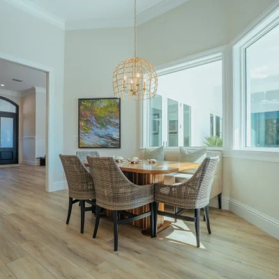 dinner table area with windows looking out at patio